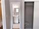This open closet with shelving is conveniently located next to the bathroom at 6658 Ramsgate Way, Norcross, GA 30093
