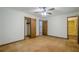 Bedroom featuring hardwood floors, white walls, a doorway, and a closet at 109 Amberidge Nw Dr, Cartersville, GA 30121