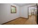 Cozy room featuring hardwood floors, a window letting in natural light, and a view into the kitchen at 109 Amberidge Nw Dr, Cartersville, GA 30121