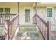 Stone steps leading to the front door and covered front porch of a single-story home at 109 Amberidge Nw Dr, Cartersville, GA 30121