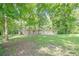 Charming single-story stone home nestled among mature trees and a grassy lawn at 109 Amberidge Nw Dr, Cartersville, GA 30121
