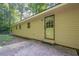 Exterior view of the back of the house with siding, a back door, and concrete steps at 109 Amberidge Nw Dr, Cartersville, GA 30121