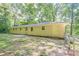 Single-story home featuring a backyard with a fence and mature trees at 109 Amberidge Nw Dr, Cartersville, GA 30121