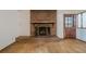 A cozy brick fireplace with wooden mantel anchors the living space at 109 Amberidge Nw Dr, Cartersville, GA 30121