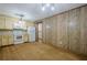 Bright kitchen with wooden wall paneling, classic appliances, and plenty of cabinet storage at 109 Amberidge Nw Dr, Cartersville, GA 30121