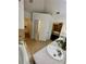 Bathroom with double sinks, separate tub, and doorway to a walk-in closet at 2479 Mitford Ct, Dacula, GA 30019
