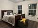 Cozy bedroom with a comfortable bed and ample natural light from the large windows at 2479 Mitford Ct, Dacula, GA 30019