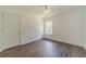 Bright bedroom with wood floors, window, and plenty of natural light at 2479 Mitford Ct, Dacula, GA 30019