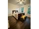 Comfortable bedroom featuring a ceiling fan, windows, and a bed with brown wood frames at 2479 Mitford Ct, Dacula, GA 30019