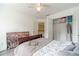 Cozy bedroom with ceiling fan, modern decor, and a closet for ample storage at 2479 Mitford Ct, Dacula, GA 30019