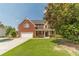 Home's front yard, highlighting the well-maintained lawn and brick exterior at 2479 Mitford Ct, Dacula, GA 30019