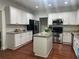 Spacious kitchen features white cabinetry, granite counters, and stainless steel appliances at 2479 Mitford Ct, Dacula, GA 30019