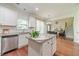 Contemporary kitchen with granite countertops, stainless steel appliances, and easy access to living spaces at 2479 Mitford Ct, Dacula, GA 30019