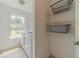 Bright laundry room featuring a washer, dryer, and convenient wire shelving at 2479 Mitford Ct, Dacula, GA 30019