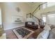 Bright living room with staircase, hardwood floors, and modern decor at 2479 Mitford Ct, Dacula, GA 30019