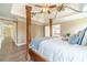 Main bedroom with a large four-poster bed and trey ceilings at 2479 Mitford Ct, Dacula, GA 30019