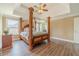Main bedroom featuring a four-poster bed, ceiling fan, and trey ceiling at 2479 Mitford Ct, Dacula, GA 30019