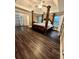 Spacious main bedroom featuring a tray ceiling, hardwood floors, and lots of natural light at 2479 Mitford Ct, Dacula, GA 30019