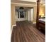 Spacious main bedroom with dark hardwood floors and a doorway to the en-suite bathroom at 2479 Mitford Ct, Dacula, GA 30019