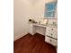 A small home office nook or space with a built-in desk and hardwood floors at 2479 Mitford Ct, Dacula, GA 30019