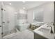 Relaxing bathroom with a glass enclosed shower, freestanding tub, and double sink vanity at 522 Hargrove Ln, Decatur, GA 30030