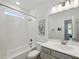 Bright bathroom with tub and shower combo, and ample counter space at 522 Hargrove Ln, Decatur, GA 30030