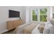 Relaxing bedroom with neutral palette, modern furniture, and a large window for natural light at 522 Hargrove Ln, Decatur, GA 30030