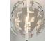 Unique white and chrome chandelier with interesting angles provides a focal point and warm lighting at 522 Hargrove Ln, Decatur, GA 30030