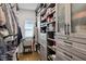 Organized walk-in closet with custom shelving, drawers, and hanging space for clothing and accessories at 522 Hargrove Ln, Decatur, GA 30030