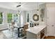 The dining area offers hardwood floors and stylish decor with the kitchen and island visible at 522 Hargrove Ln, Decatur, GA 30030