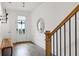 Welcoming entryway featuring hardwood floors, modern lighting, and a decorative mirror at 522 Hargrove Ln, Decatur, GA 30030