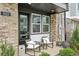 A cozy front porch features chairs, potted plants, and charming decor at the home's entrance at 522 Hargrove Ln, Decatur, GA 30030