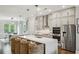 The kitchen and dining area feature lots of light with a large quartz island and pendant lighting at 522 Hargrove Ln, Decatur, GA 30030