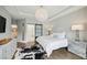 Comfortable main bedroom boasting modern lighting, natural light, and en-suite bathroom access at 522 Hargrove Ln, Decatur, GA 30030