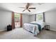 Bedroom featuring neutral carpet, a ceiling fan, and plenty of natural light at 5971 Dogwood Se Dr, Acworth, GA 30102
