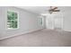 The large bedroom provides an abundance of natural light that complements the neutral carpeting at 5971 Dogwood Se Dr, Acworth, GA 30102