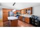 Charming kitchen with stainless steel appliances, an island, wood floors and ample cabinet space at 5971 Dogwood Se Dr, Acworth, GA 30102