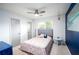 Cozy bedroom featuring a comfortable bed, natural light, and simple decor, perfect for relaxation at 609 Hearth Pl, Lawrenceville, GA 30043