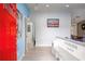 Inviting foyer with hardwood floors, blue accent walls, and inspiring 'Love Laughter & Friends' inscription at 609 Hearth Pl, Lawrenceville, GA 30043