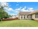 Large backyard features a well-manicured lawn and a wooden fence at 9550 Canvasback Ct, Jonesboro, GA 30238