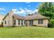 Expansive backyard featuring a well-maintained lawn and mature trees, perfect for outdoor activities and relaxation at 9550 Canvasback Ct, Jonesboro, GA 30238