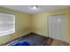 Bedroom featuring a window and a closet at 9550 Canvasback Ct, Jonesboro, GA 30238