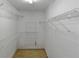 Walk-in closet with metal racks for storage at 9550 Canvasback Ct, Jonesboro, GA 30238