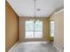 Dining room featuring a decorative chandelier and a window view to the yard at 9550 Canvasback Ct, Jonesboro, GA 30238