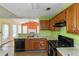 Open kitchen with stainless steel appliances and a view to the living room at 9550 Canvasback Ct, Jonesboro, GA 30238
