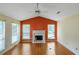Bright living room featuring hardwood floors, a white fireplace, and vaulted ceilings at 9550 Canvasback Ct, Jonesboro, GA 30238