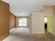 Bright living room with a chandelier, neutral walls and large window at 9550 Canvasback Ct, Jonesboro, GA 30238