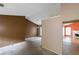 Spacious living room featuring neutral walls and a chandelier fixture at 9550 Canvasback Ct, Jonesboro, GA 30238
