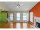 Inviting living room with hardwood floors, a fireplace, and multiple windows at 9550 Canvasback Ct, Jonesboro, GA 30238