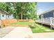 Inviting backyard featuring a well-maintained lawn, a wooden fence, and lush greenery at 1253 Lucile Sw Ave, Atlanta, GA 30310